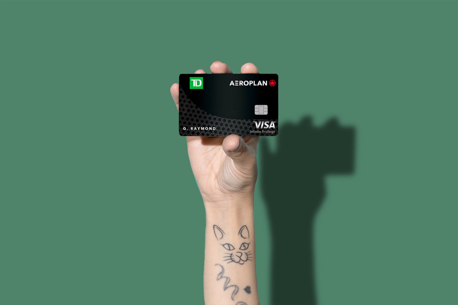 a hand holds on of the best travel credit cards in Canada