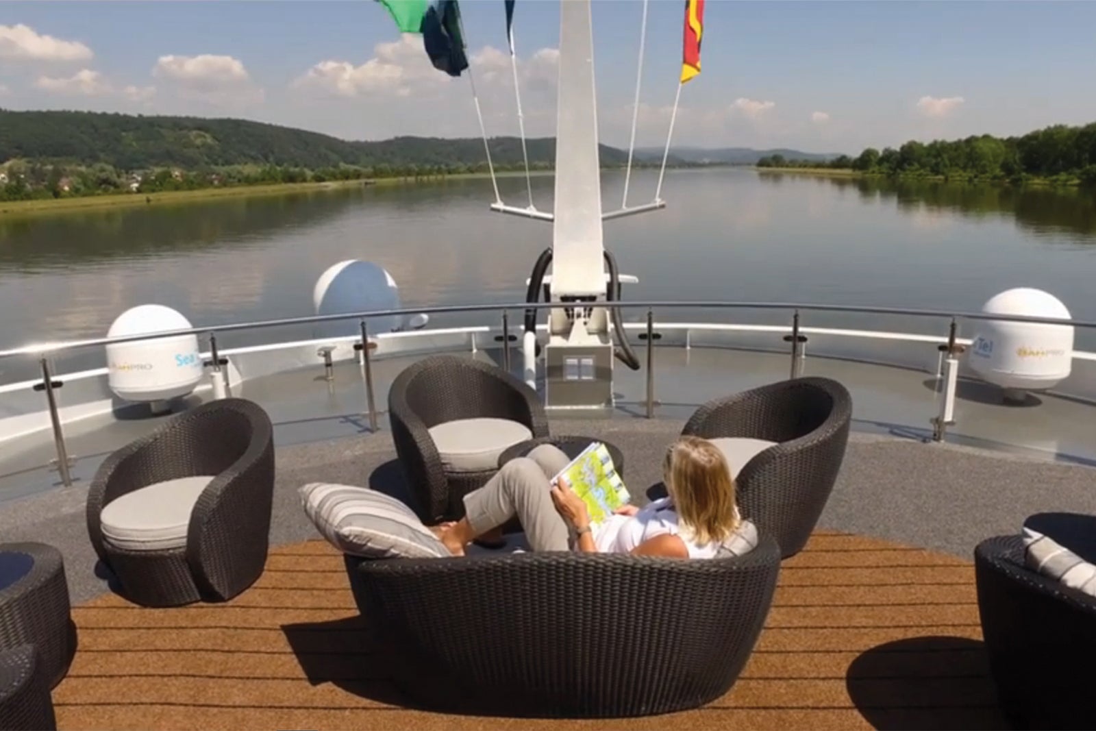 Woman looking at map on deck of river cruise ship