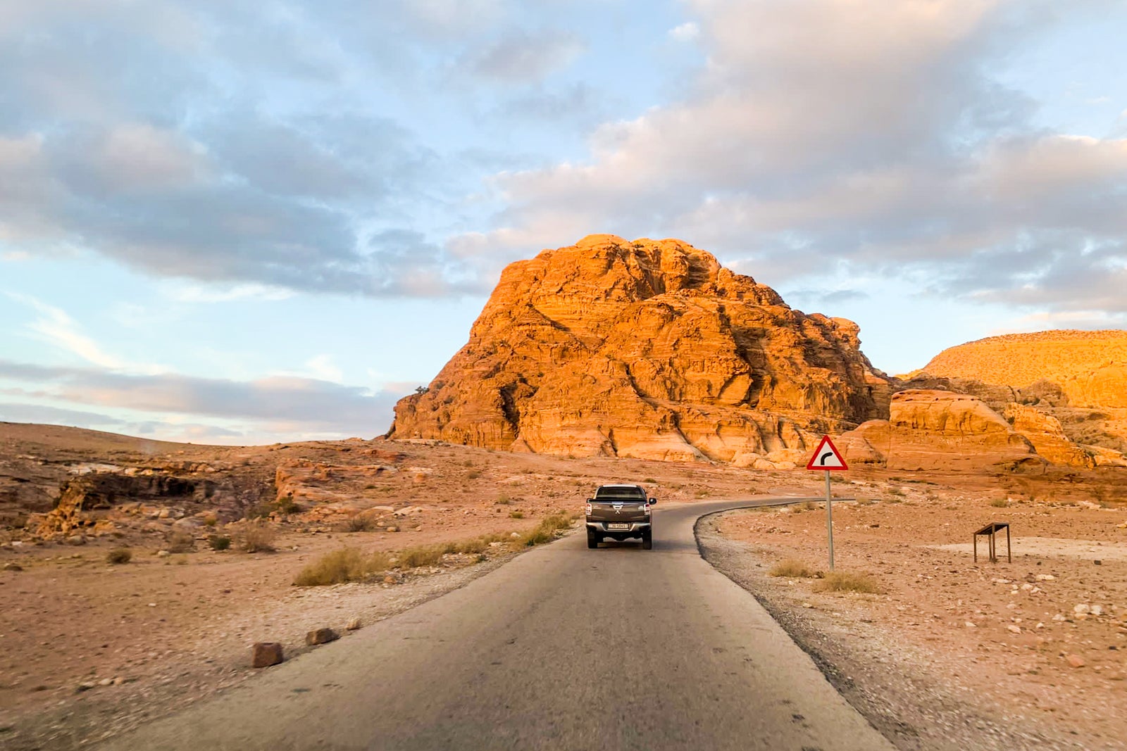 a road leads through a desert