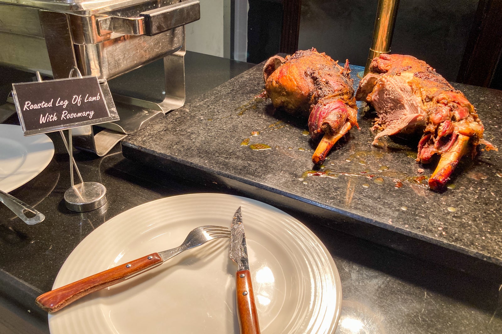 meat for carving by a chef, located at the end of a dinner buffet