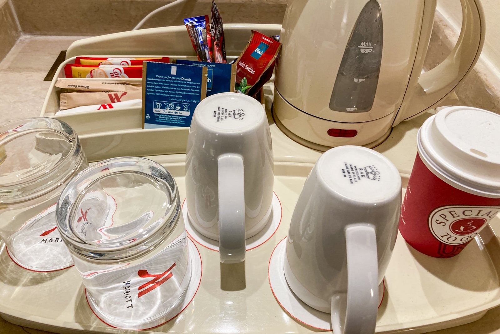 close-up of mugs and items for preparing coffee and tea in a hotel room