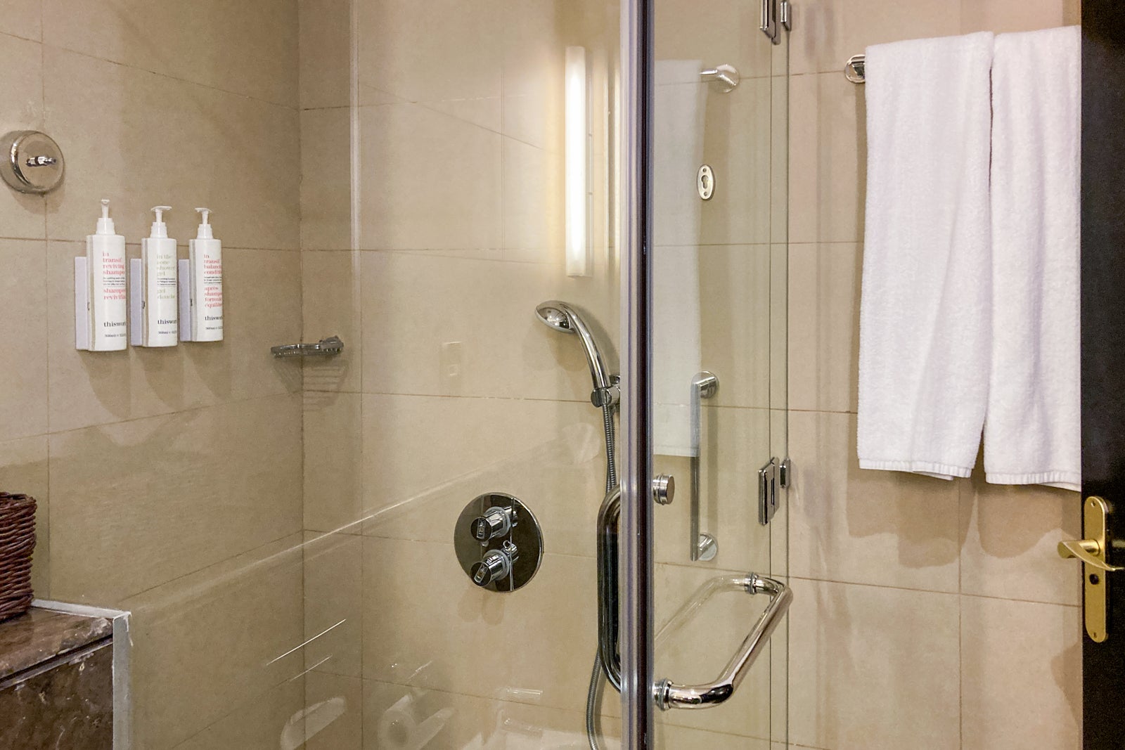 the glass shower box in a hotel bathroom