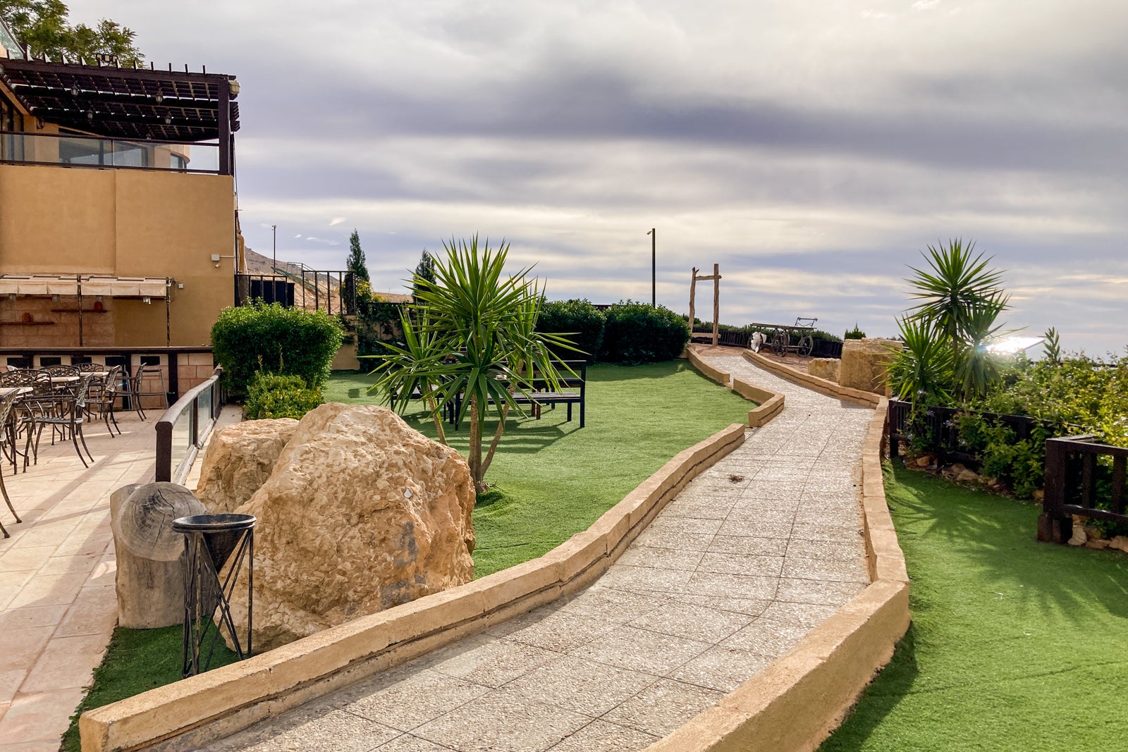 a walking path behind a hotel