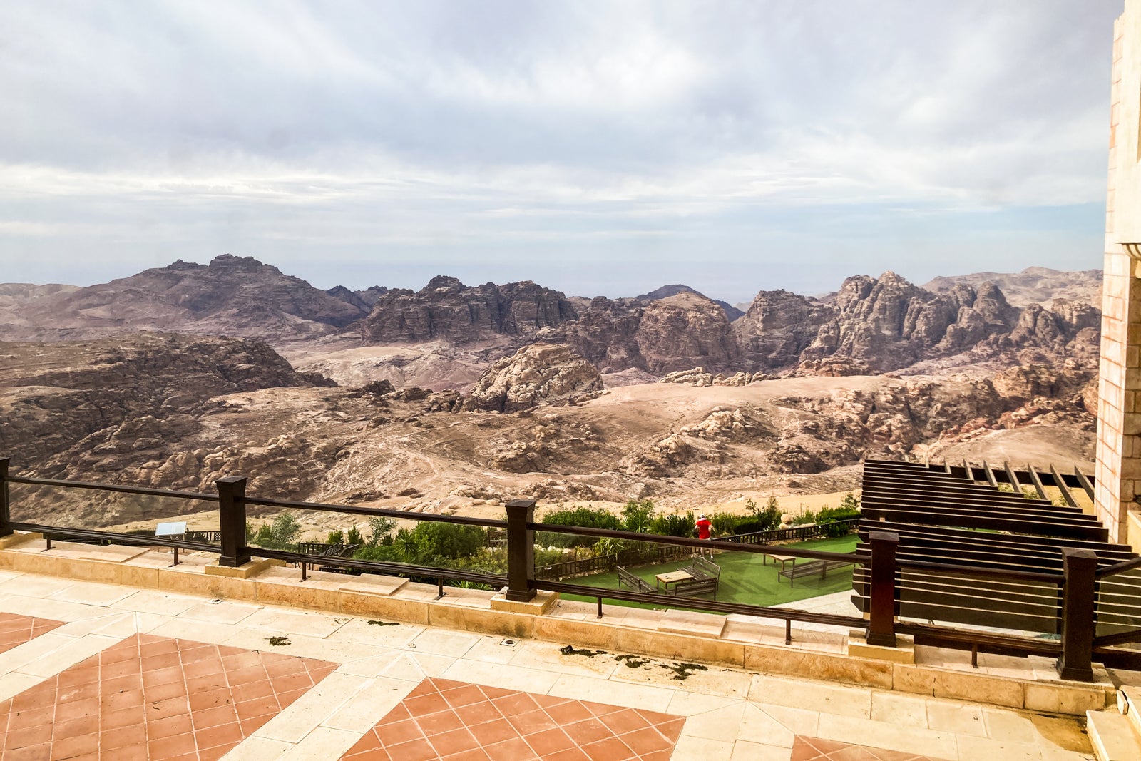 a desert beyond an outdoor pool deck at a hotel