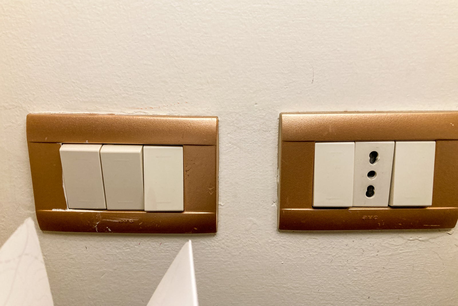 outlets and light switches on the wall