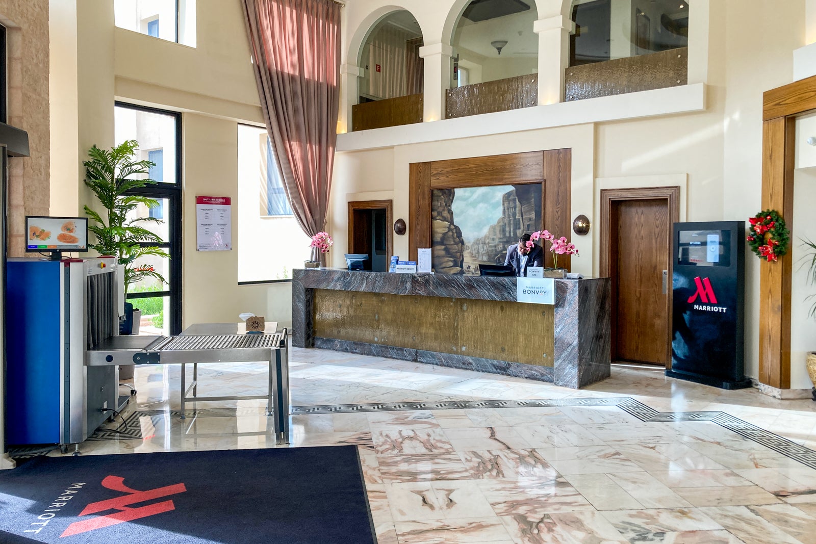 the lobby and front desk of a hotel