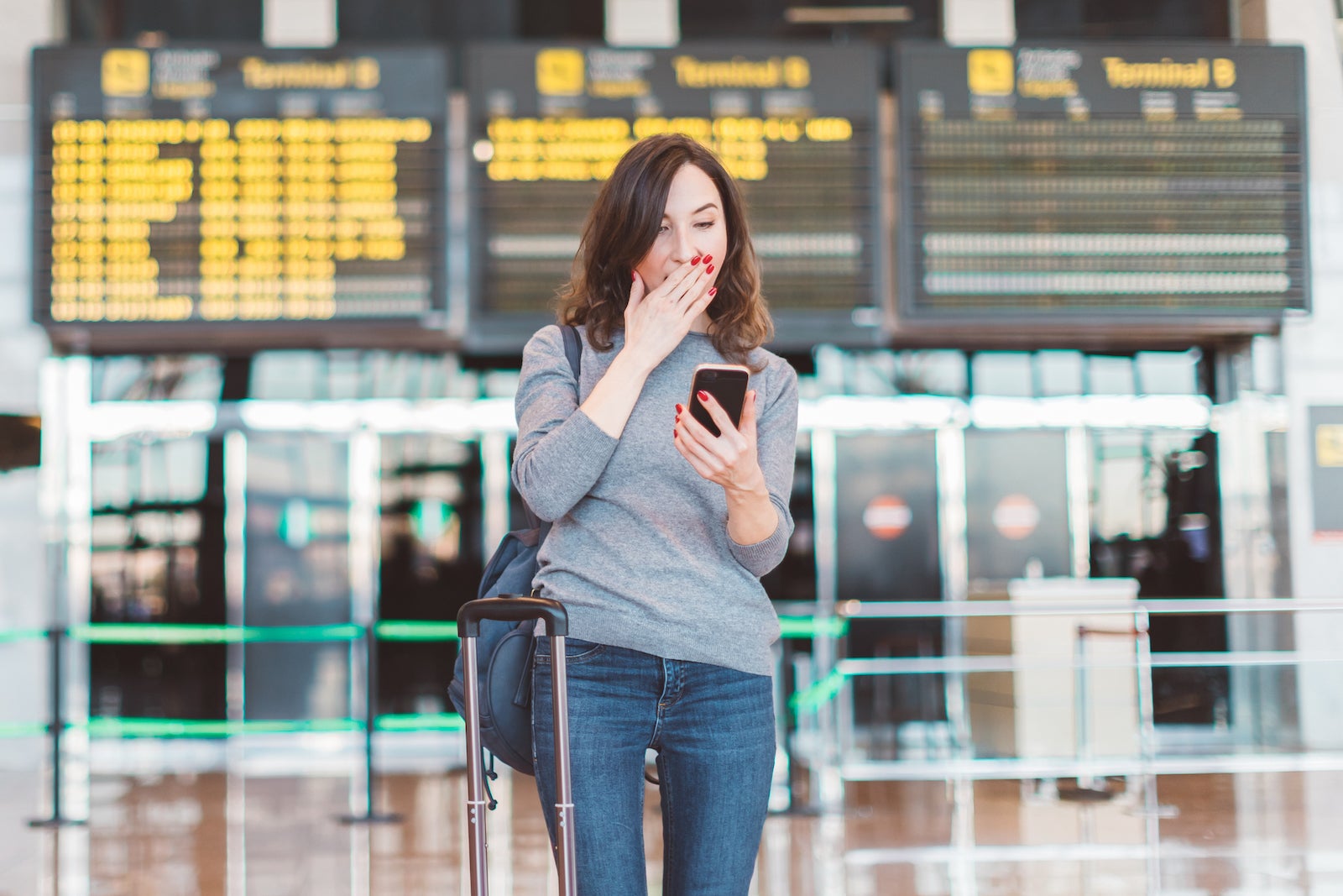 Surprised woman at airport