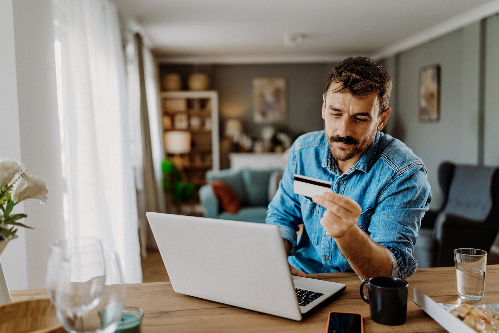 Man using laptop at home