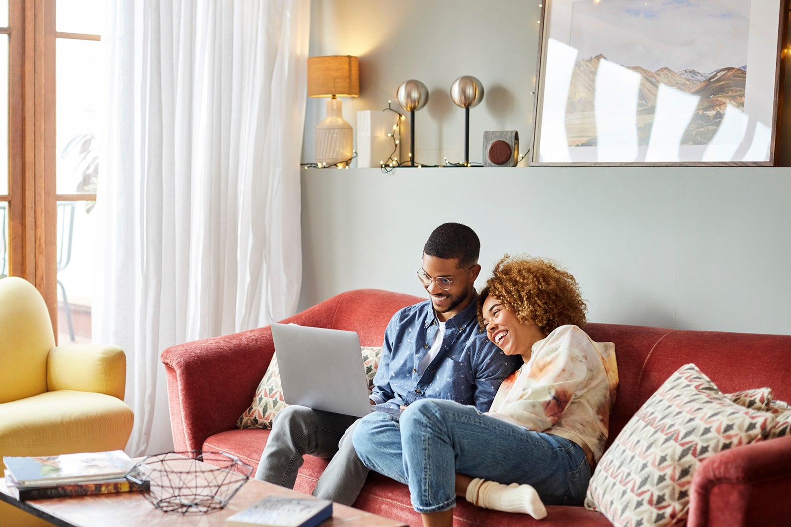 Man and woman looking at a laptop