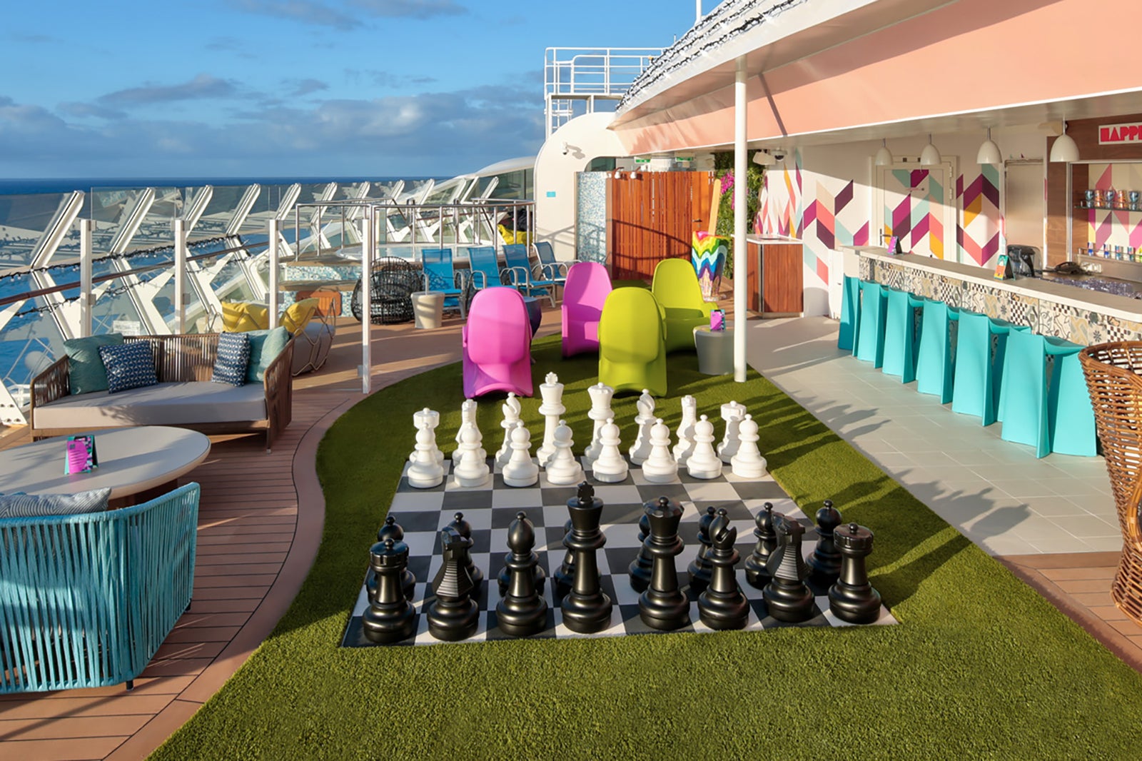 Teen club outdoor patio on cruise ship with oversized chess and mocktail bar