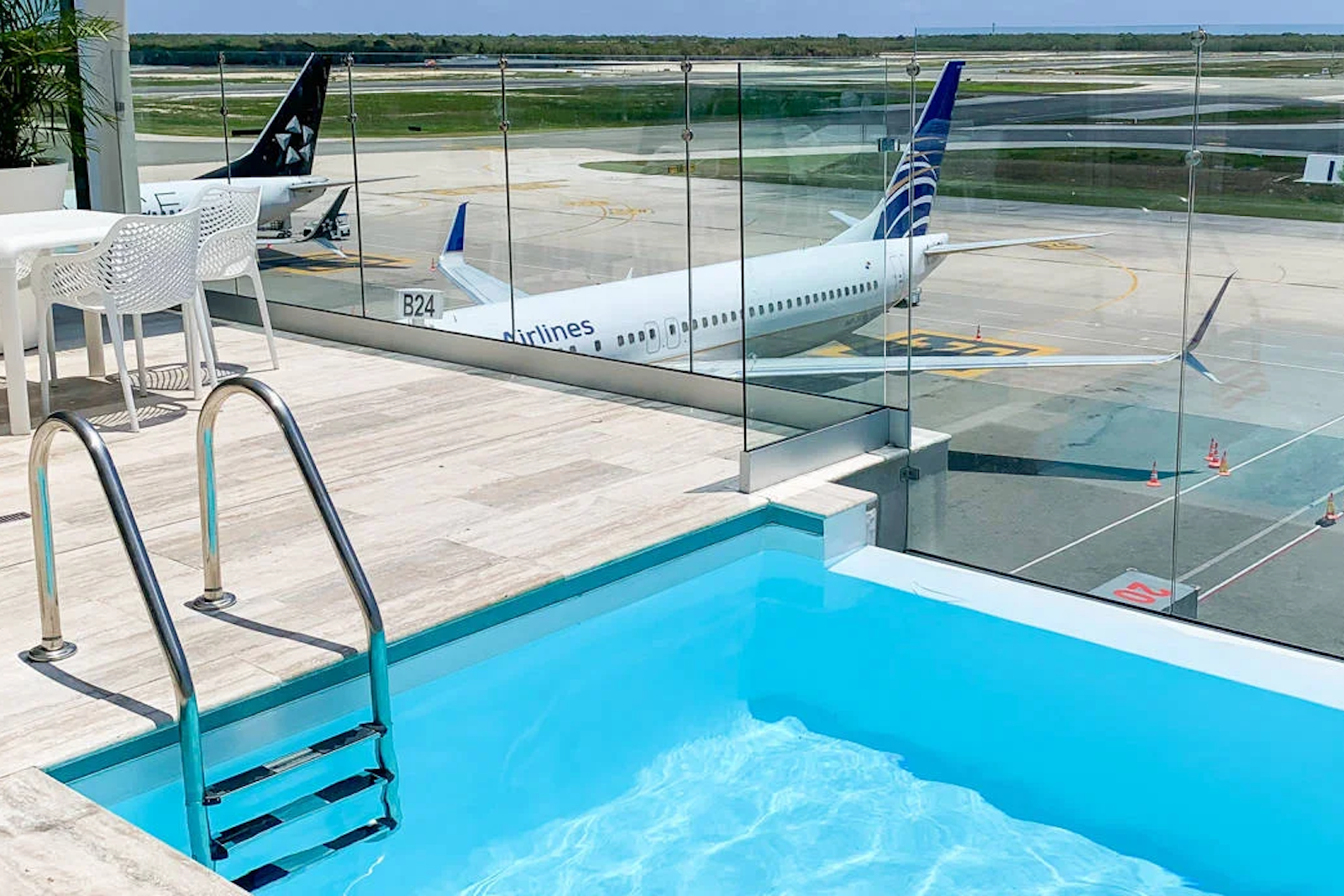 a small pool on an outdoor deck at an airport