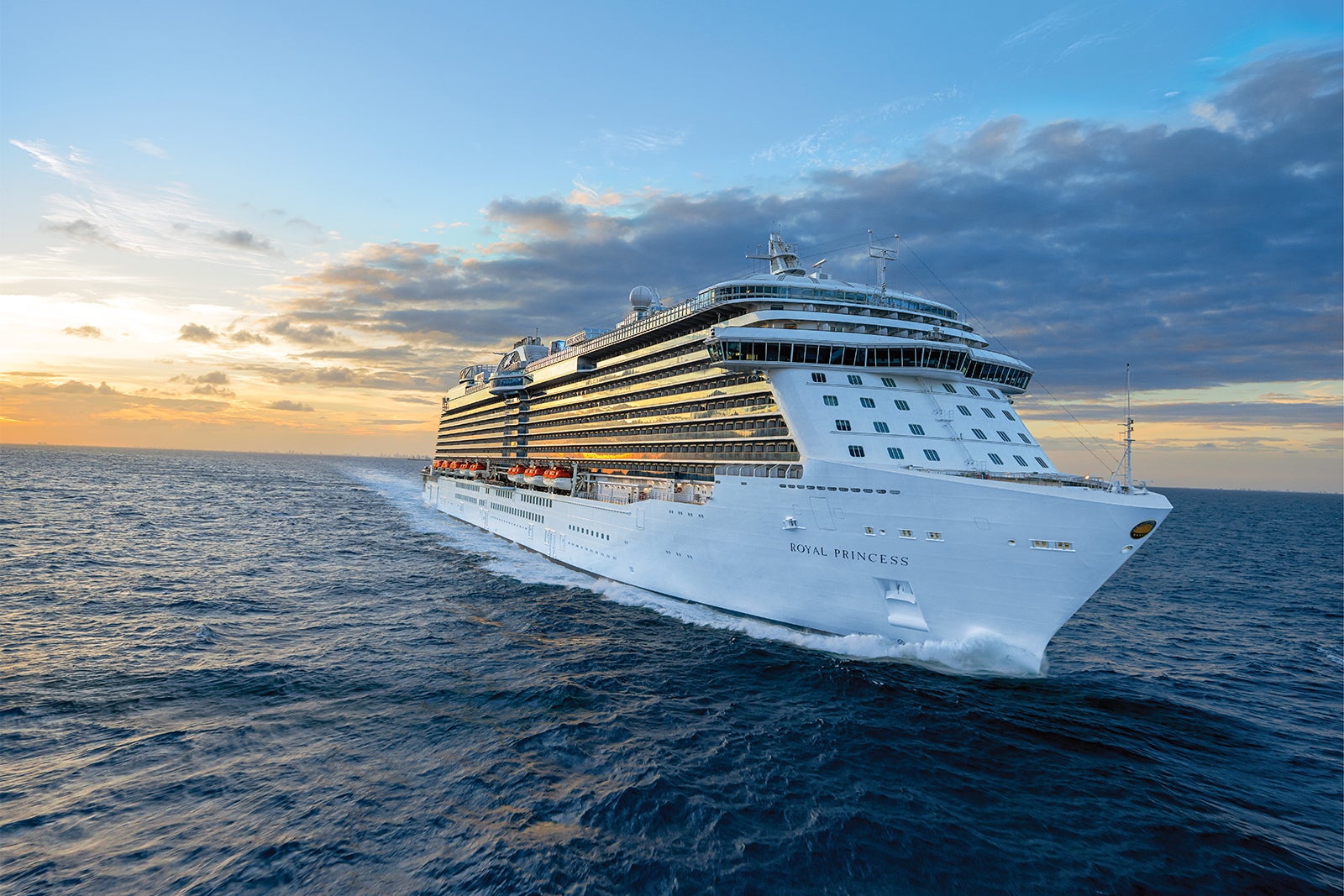 Royal Princess cruise ship at sea at sunset