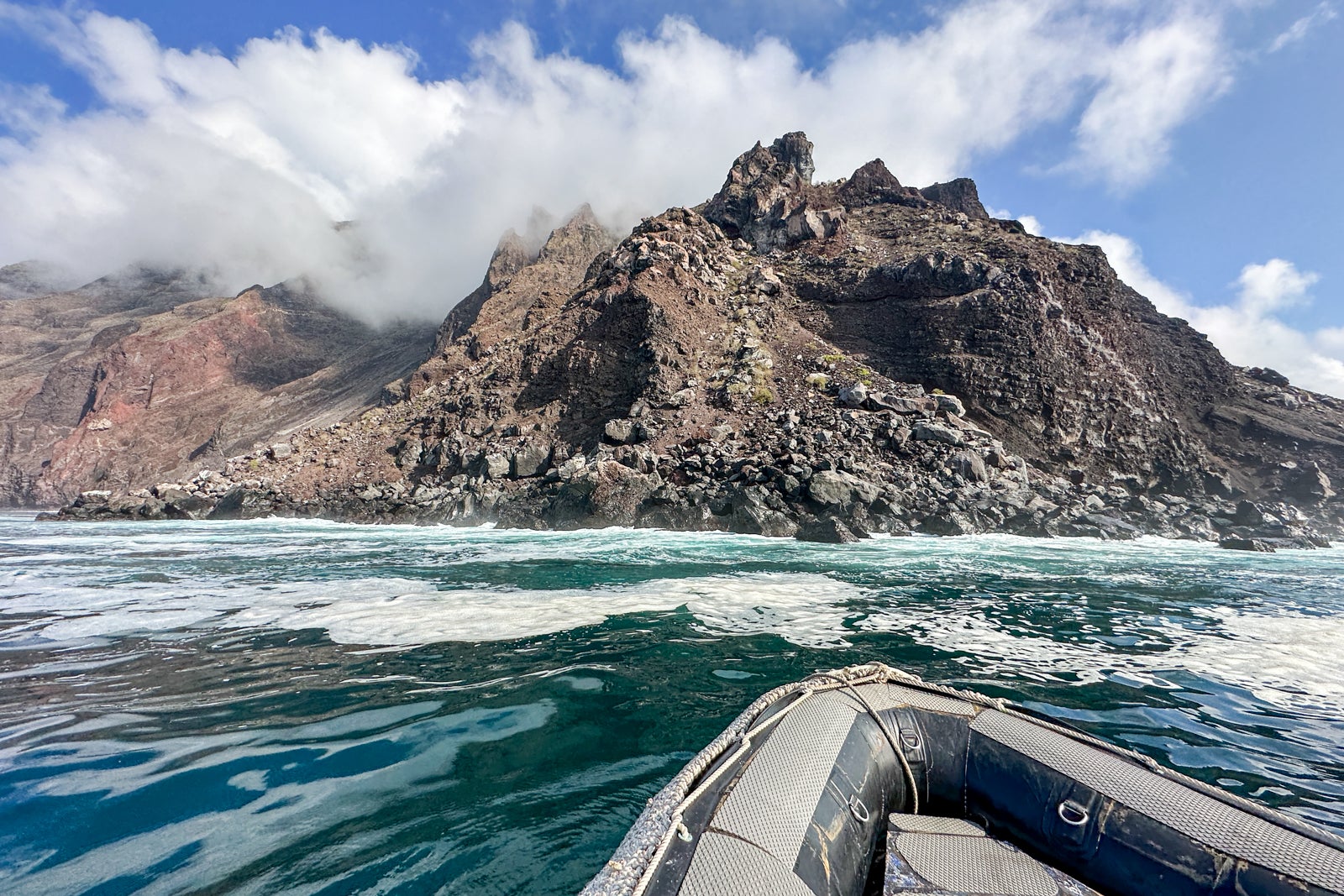 An inflatable boat takes passengers for a scenic cruise around one of the Galapagos Islands. 