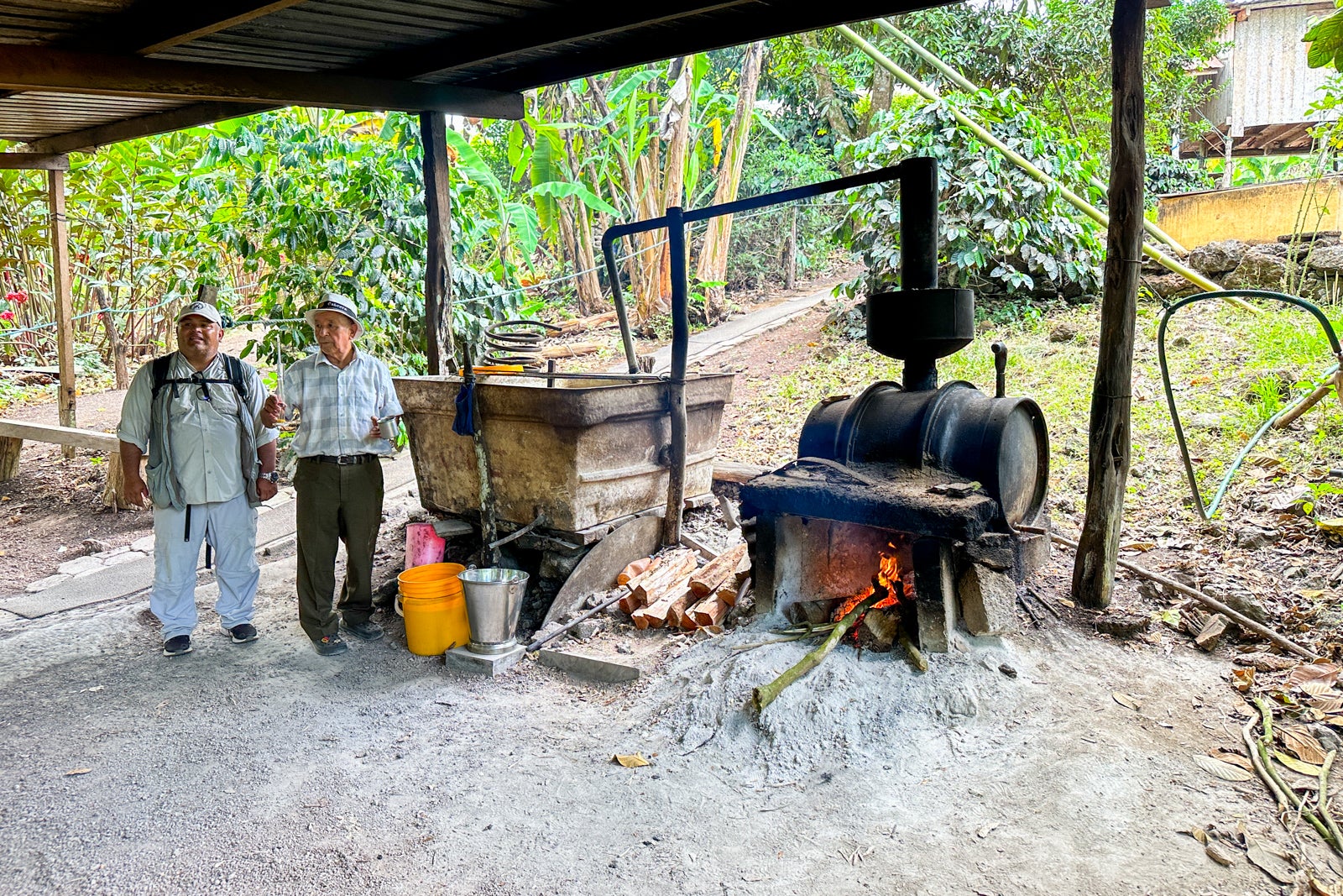 The owner of Trapiche Ecological, which produces coffee, chocolate and sugarcane moonshine, demonstrates how the latter is made.