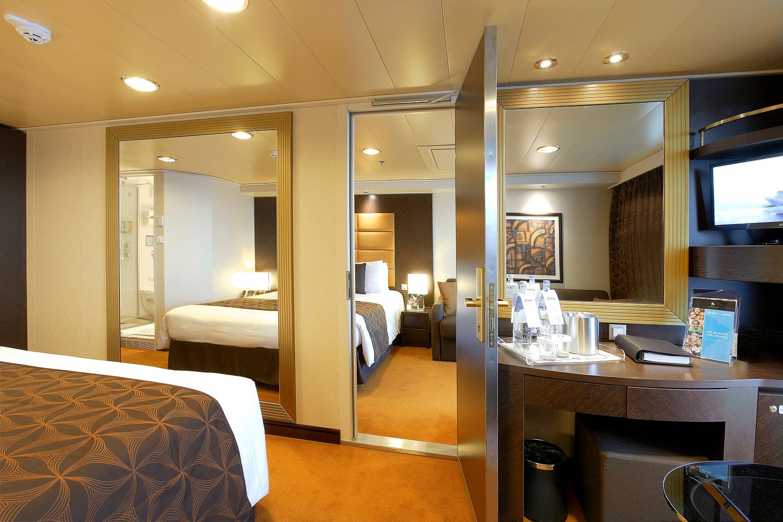 The door is open between two cruise ship cabins