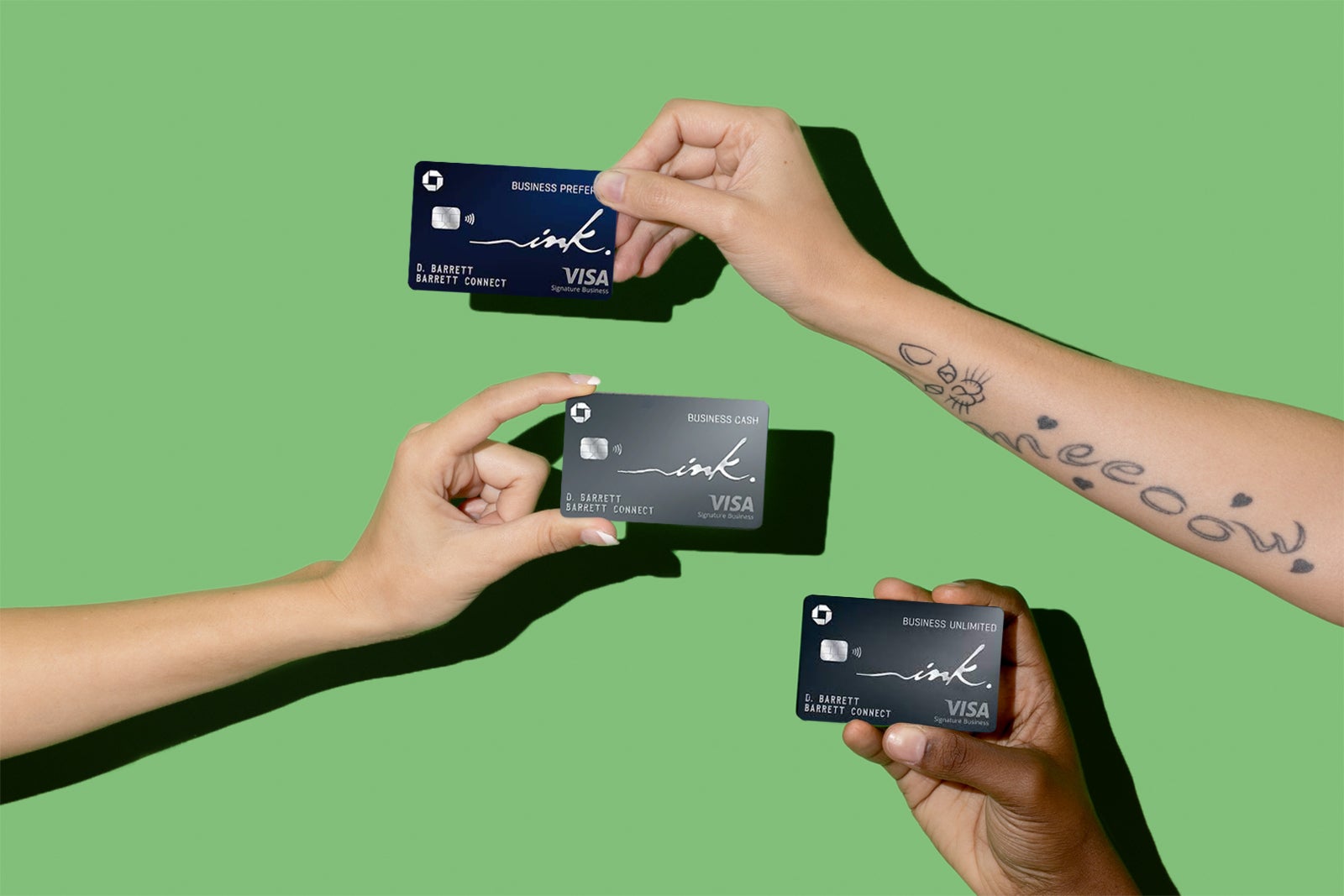 hands hold multiple Chase business credit cards