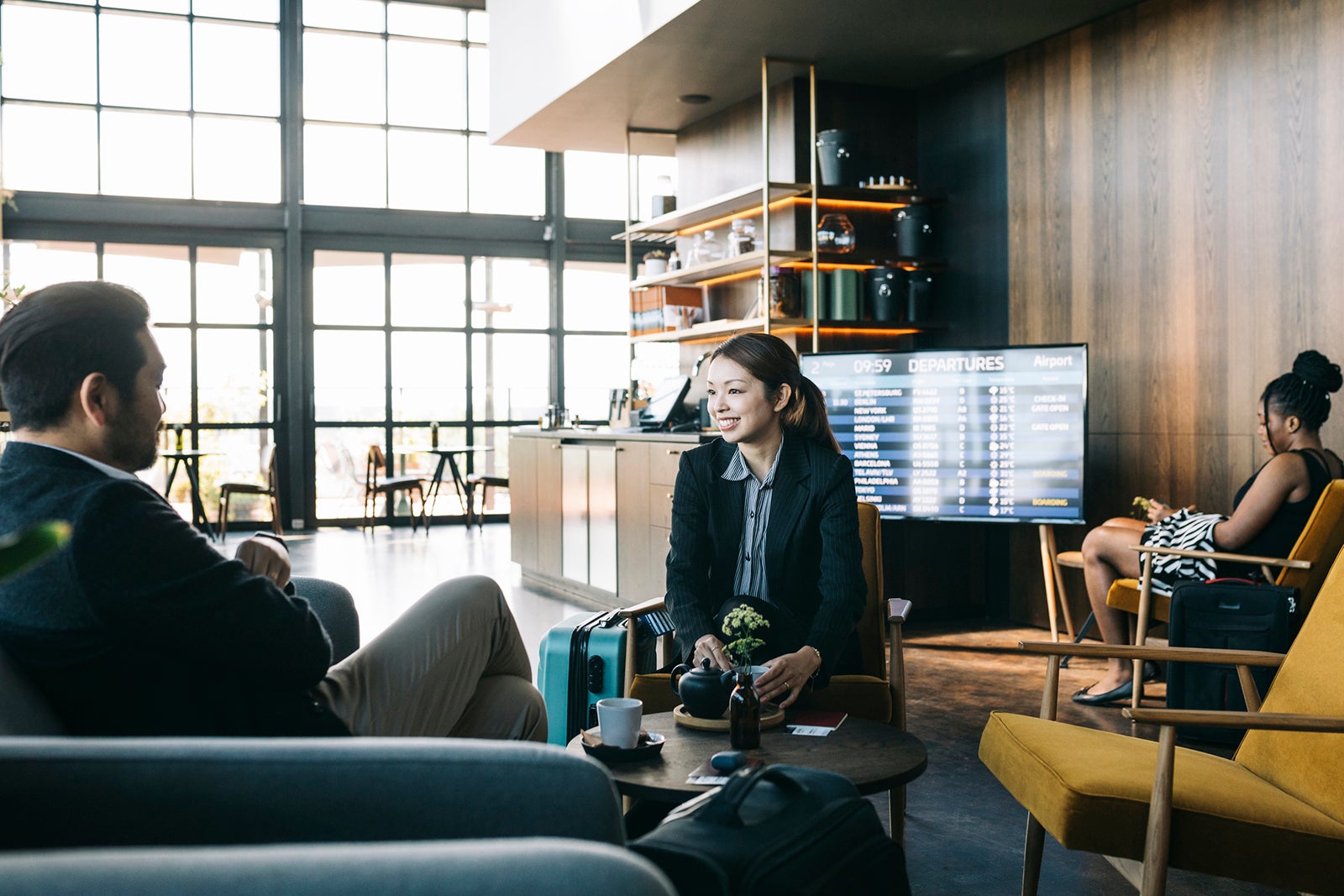 People waiting for a flight at an airport lounge