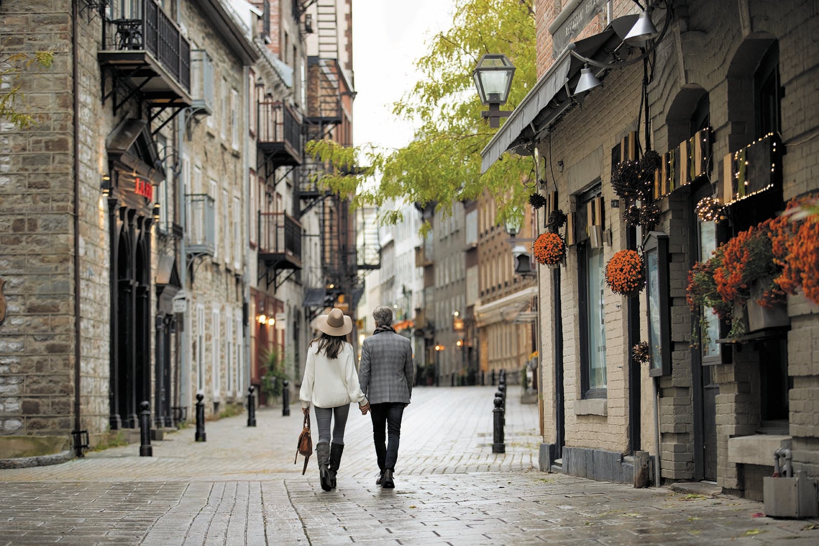 Couple walking down pedestrian street in Quebec City