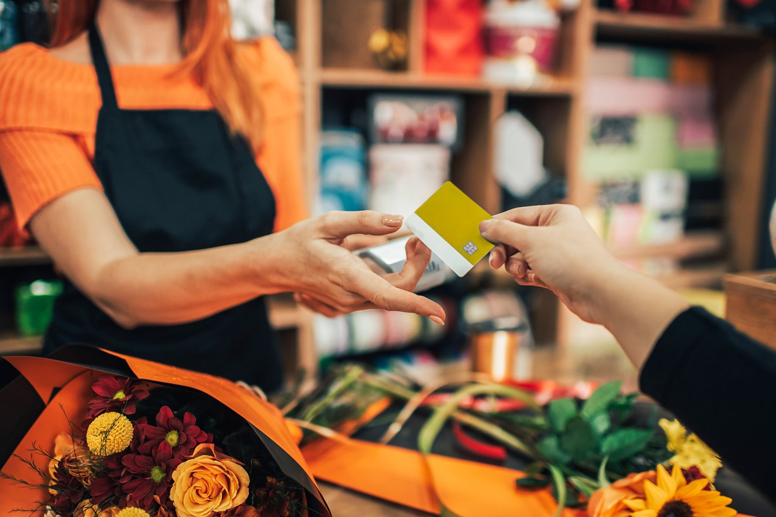 Person buys flowers using credit card