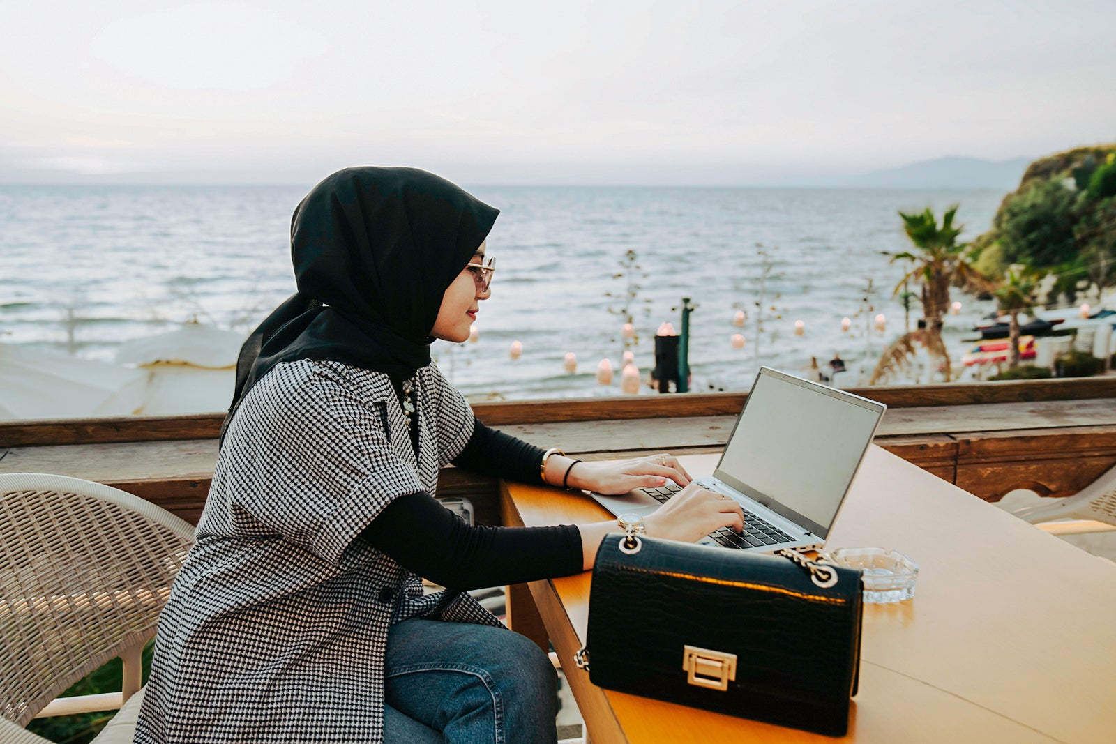 woman using her laptop outside