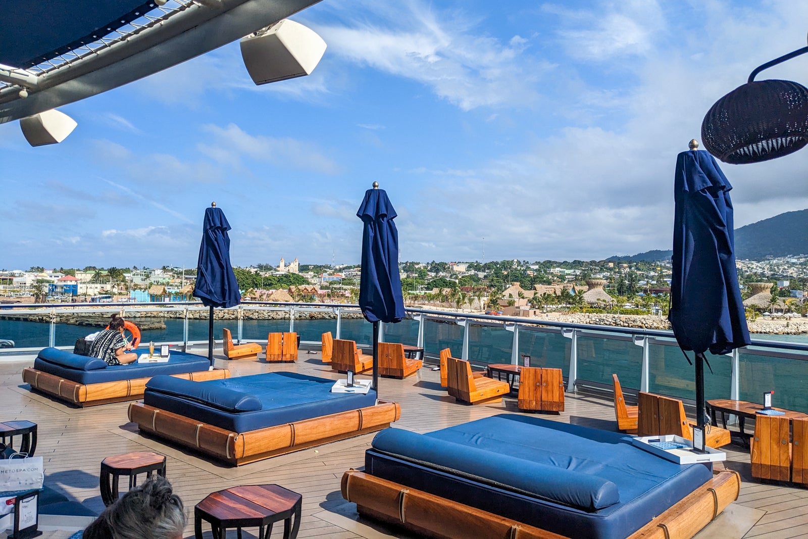 Daybeds and outdoor seating at the aft The Dock on Scarlet Lady.
