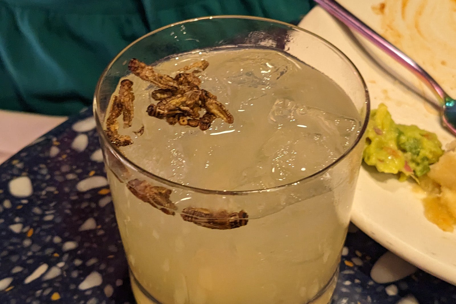 Cocktail with crickets on top