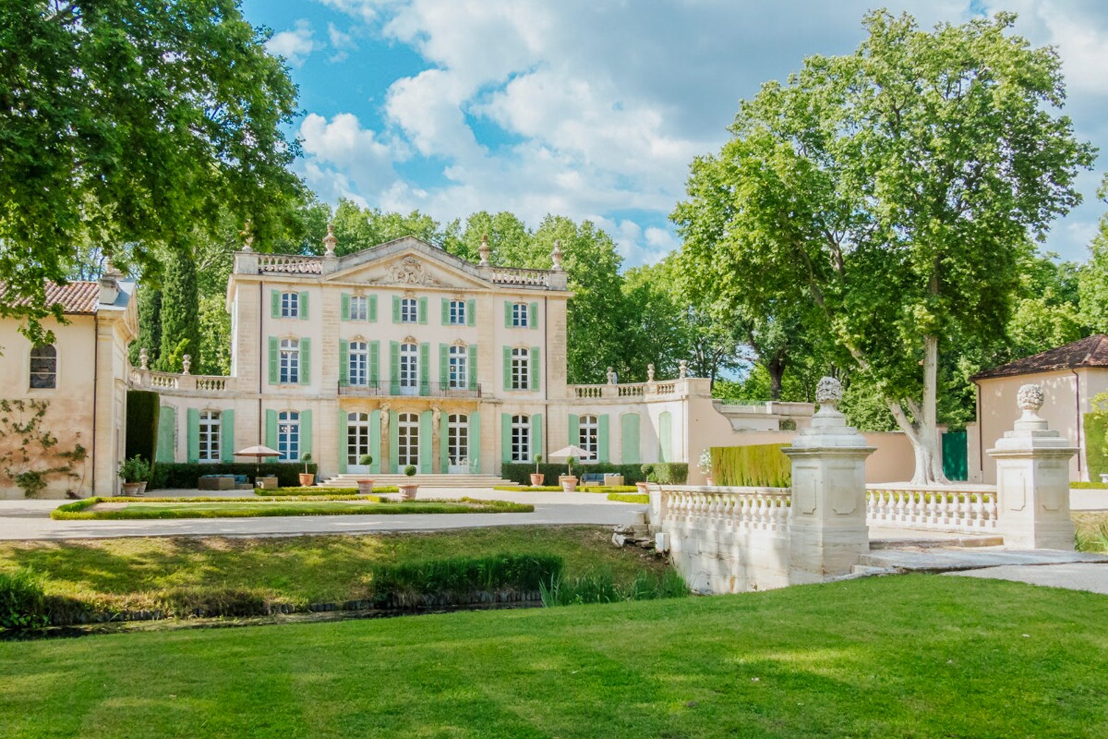 French Chateau Poesie with green trees and lawn