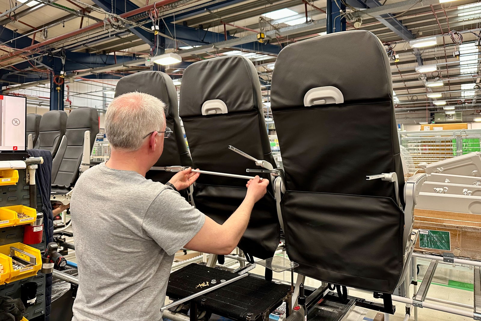 man installing tray table