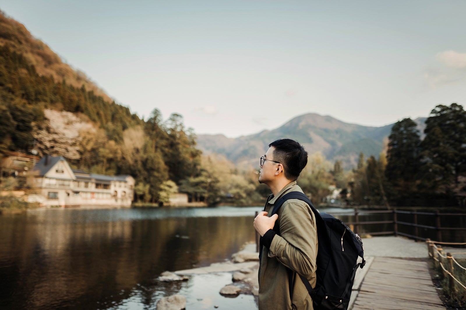 A man sightseeing at a lake in Fukuoka, Japan.