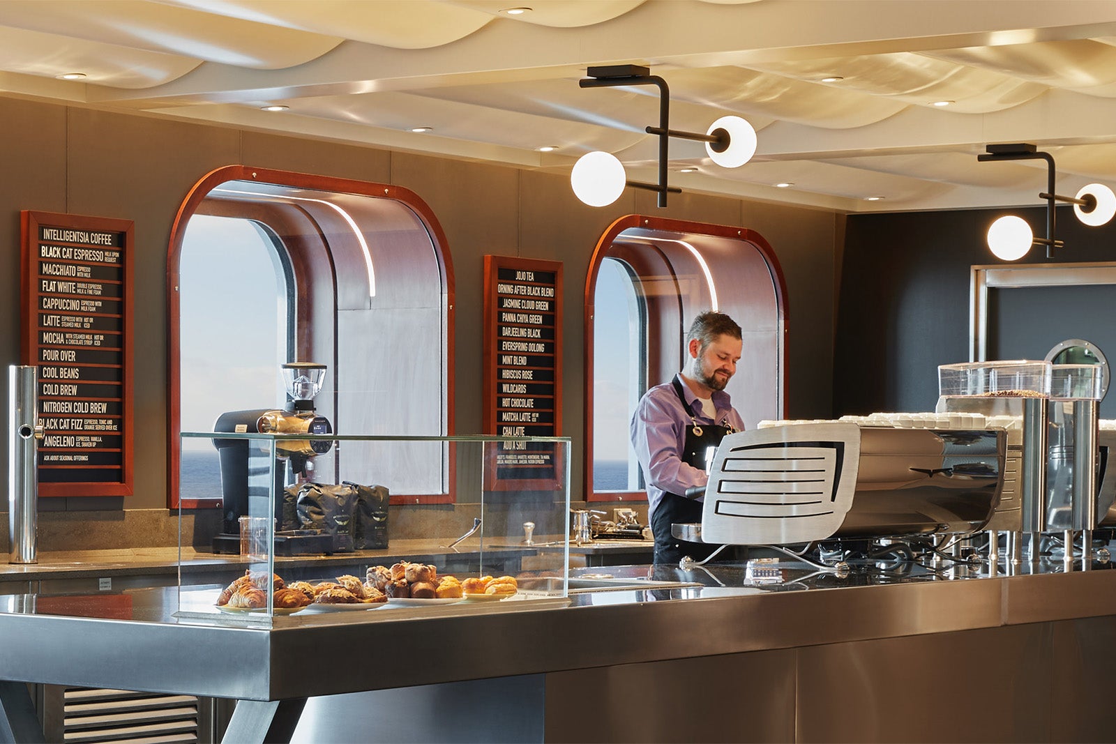 Barista working at a coffee bar on a cruise ship