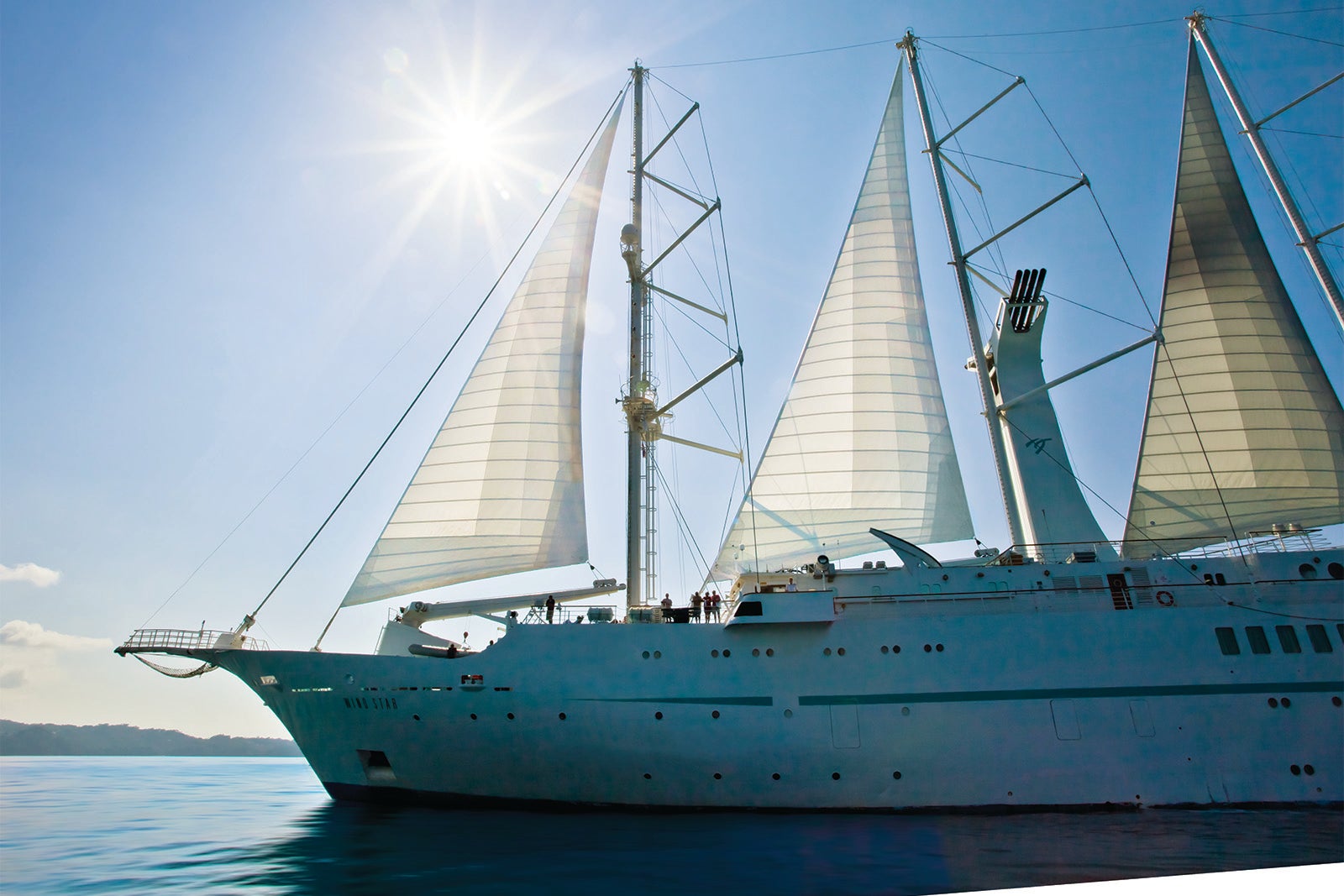 Masted cruise ship at sea