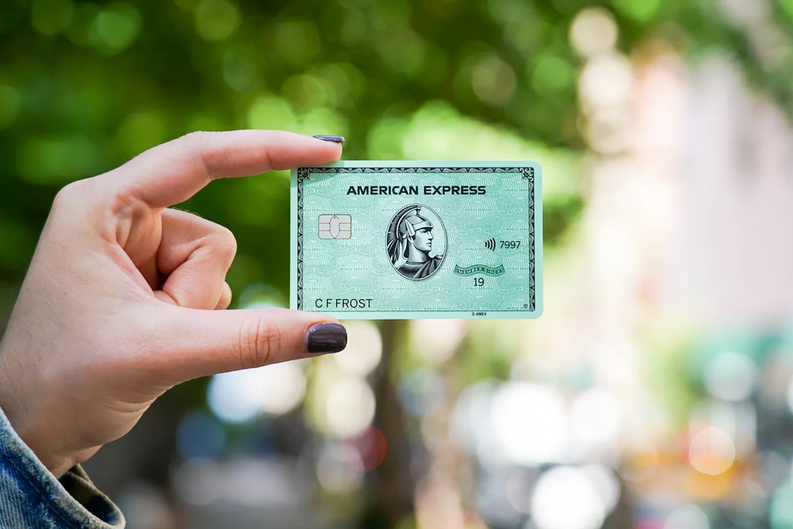 Person holds American Express card