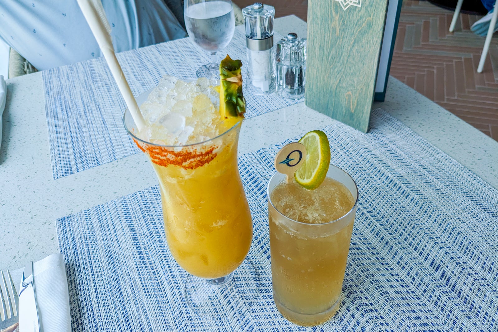 Two nonalcoholic cocktails on a restaurant table