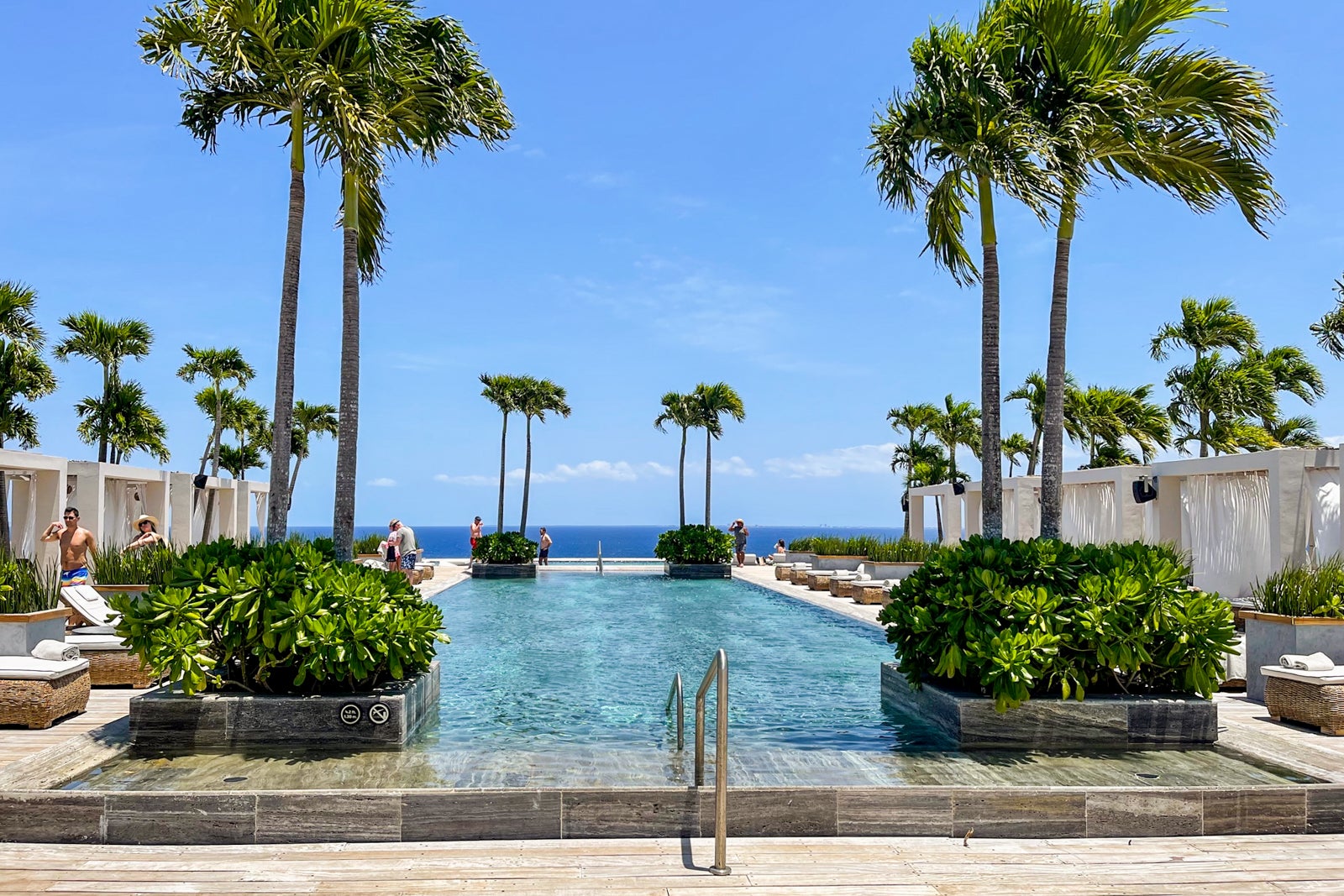 VIP rooftop pool, loungers and cabanas at Secrets Impression Moxche Playa del Carmen