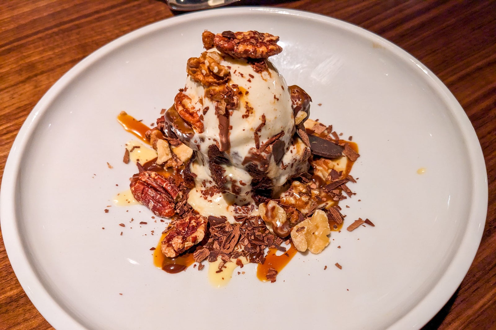 Brownie sundae with ice cream and pecans