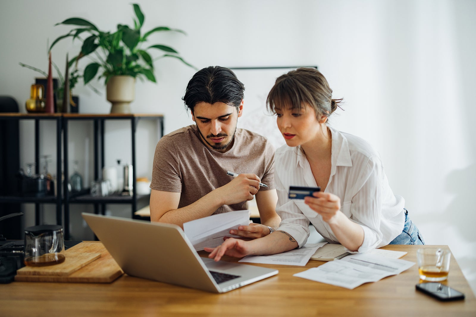 Serious Couple Paying Bills at Home