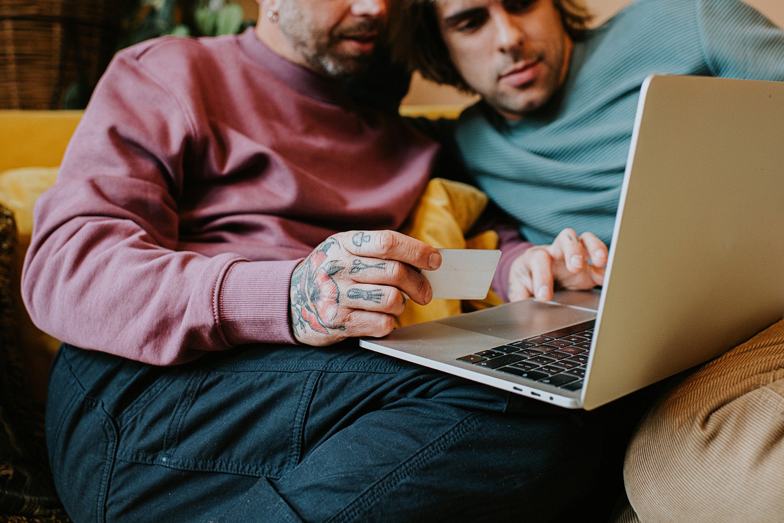 Couple shopping online with laptop