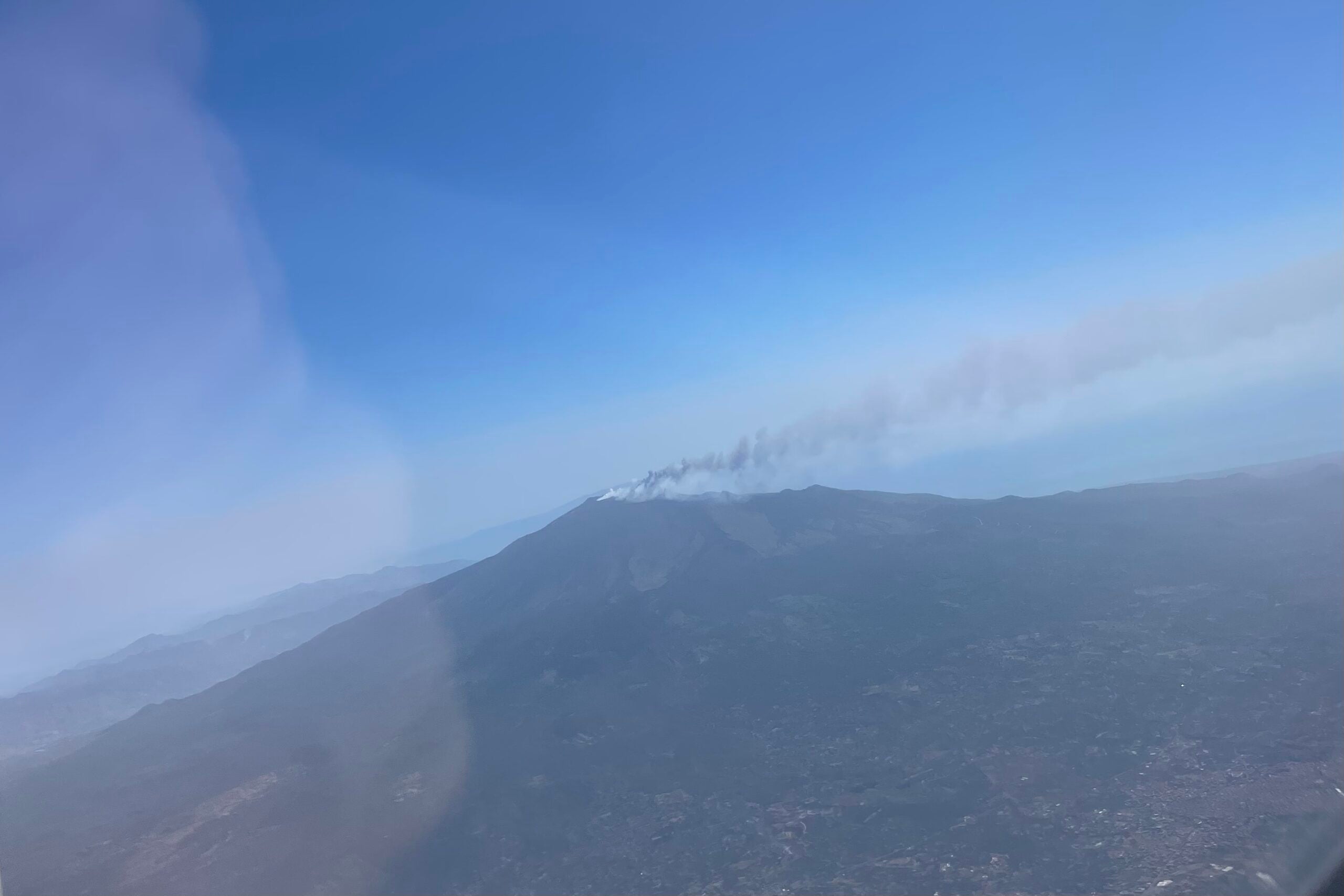 Mount Etna eruption view from arriving flight