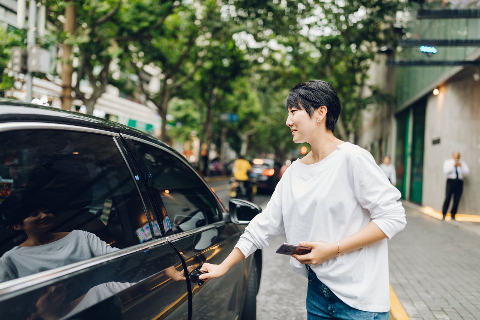 Woman getting into a ride share