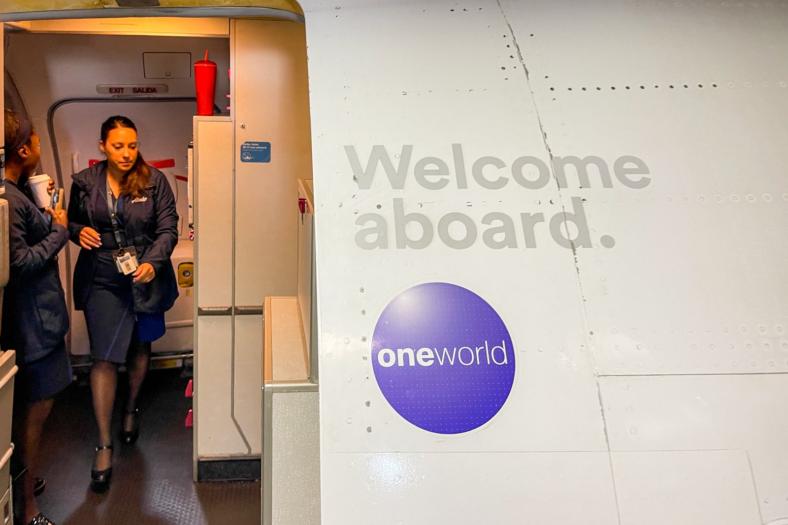 Alaska Airlines boarding door with Oneworld logo