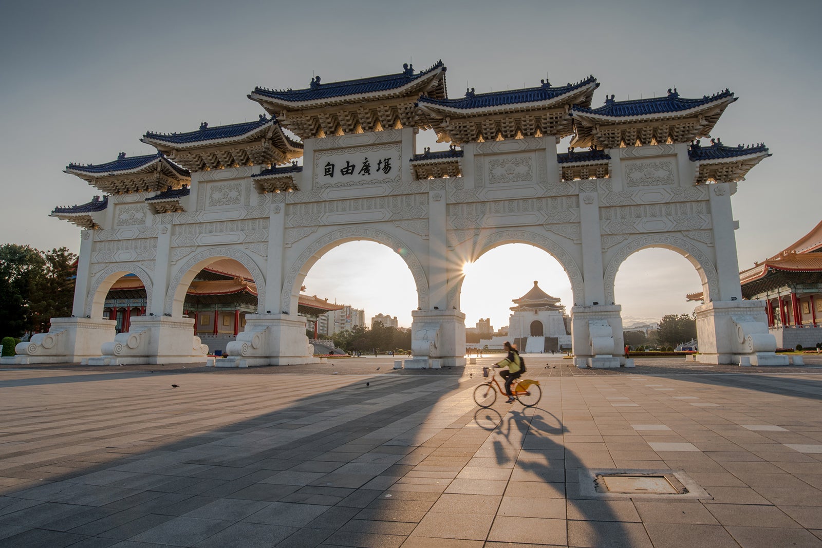 A person bikes past the front gate of Chiang Kai-Shek Memorial Hall in Taipei