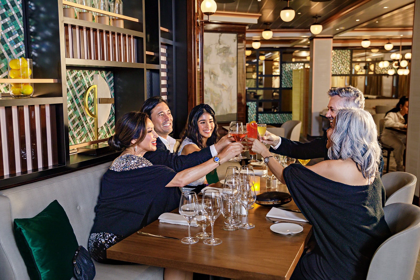 Group toasting each other at cruise ship dinner table