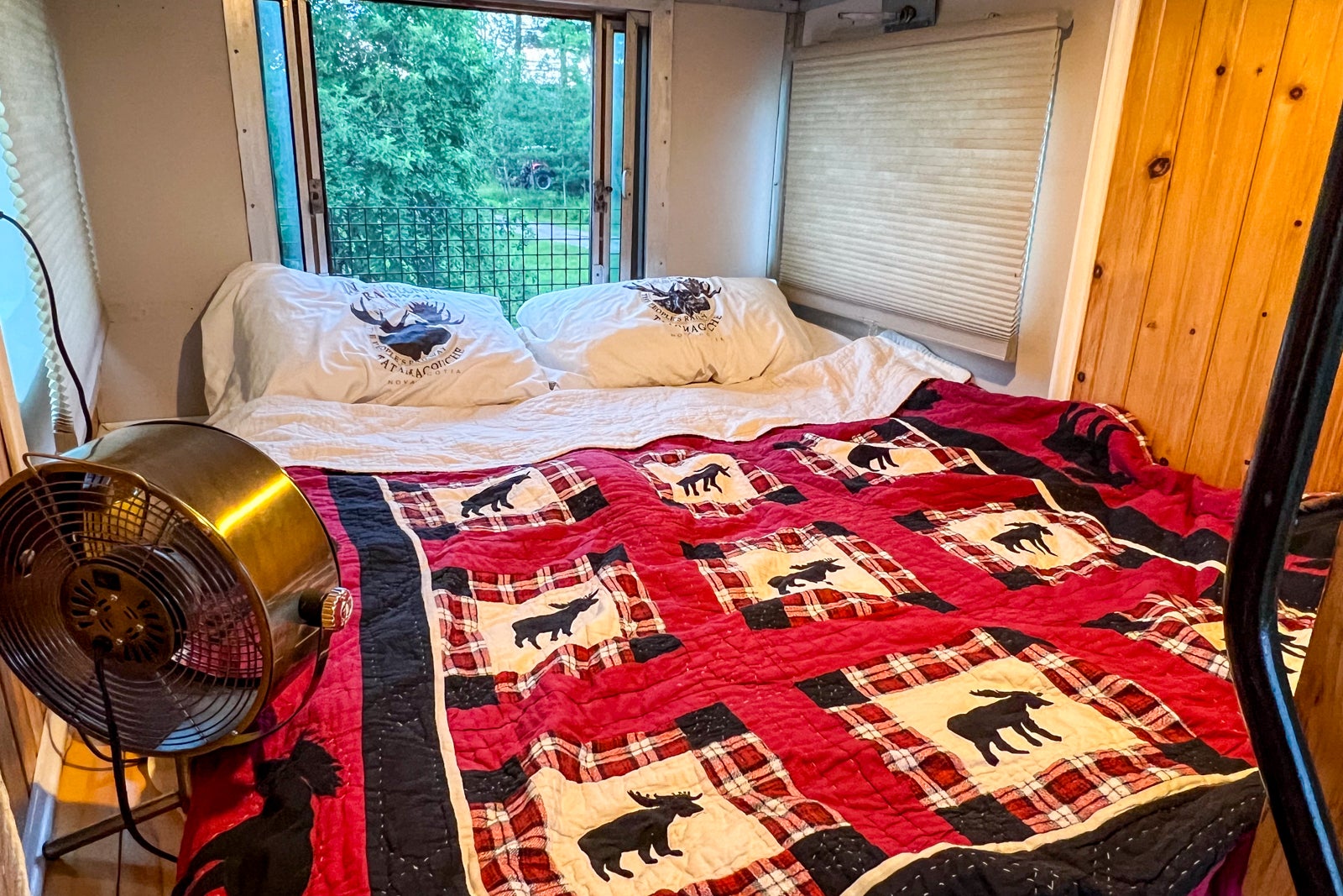 The bed in the cupola of Caboose #8 at the Train Station Inn in Tatamagouche, Nova Scotia