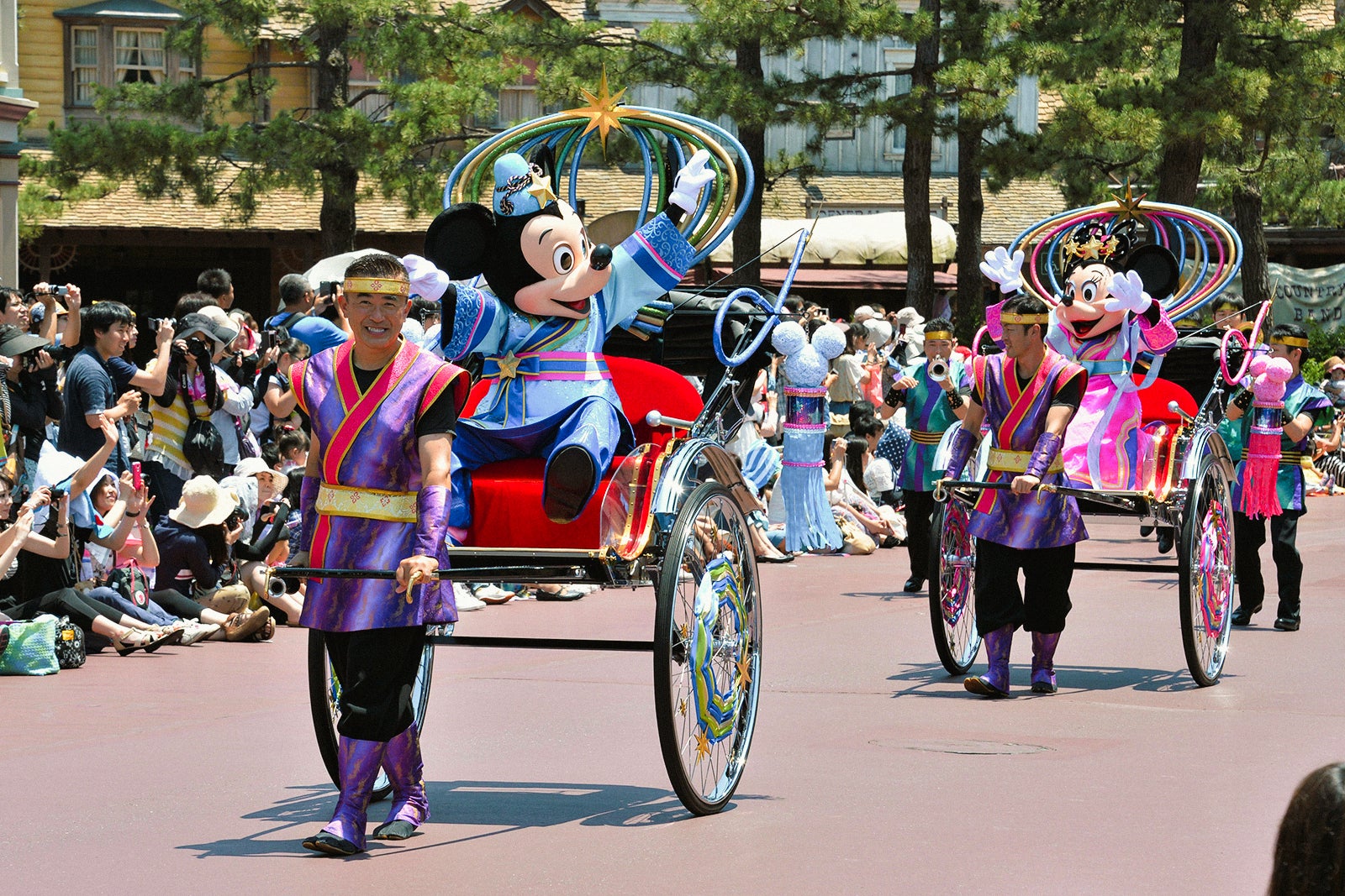 Mickey and Minnie Mouse dressed up to represent “Altair the Cowherd” and “Vega the Weaver” to celebrate Tanabata, or the Star Festival, during a special parade