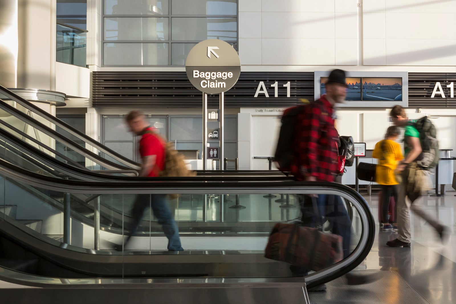 travelers walking through an airport