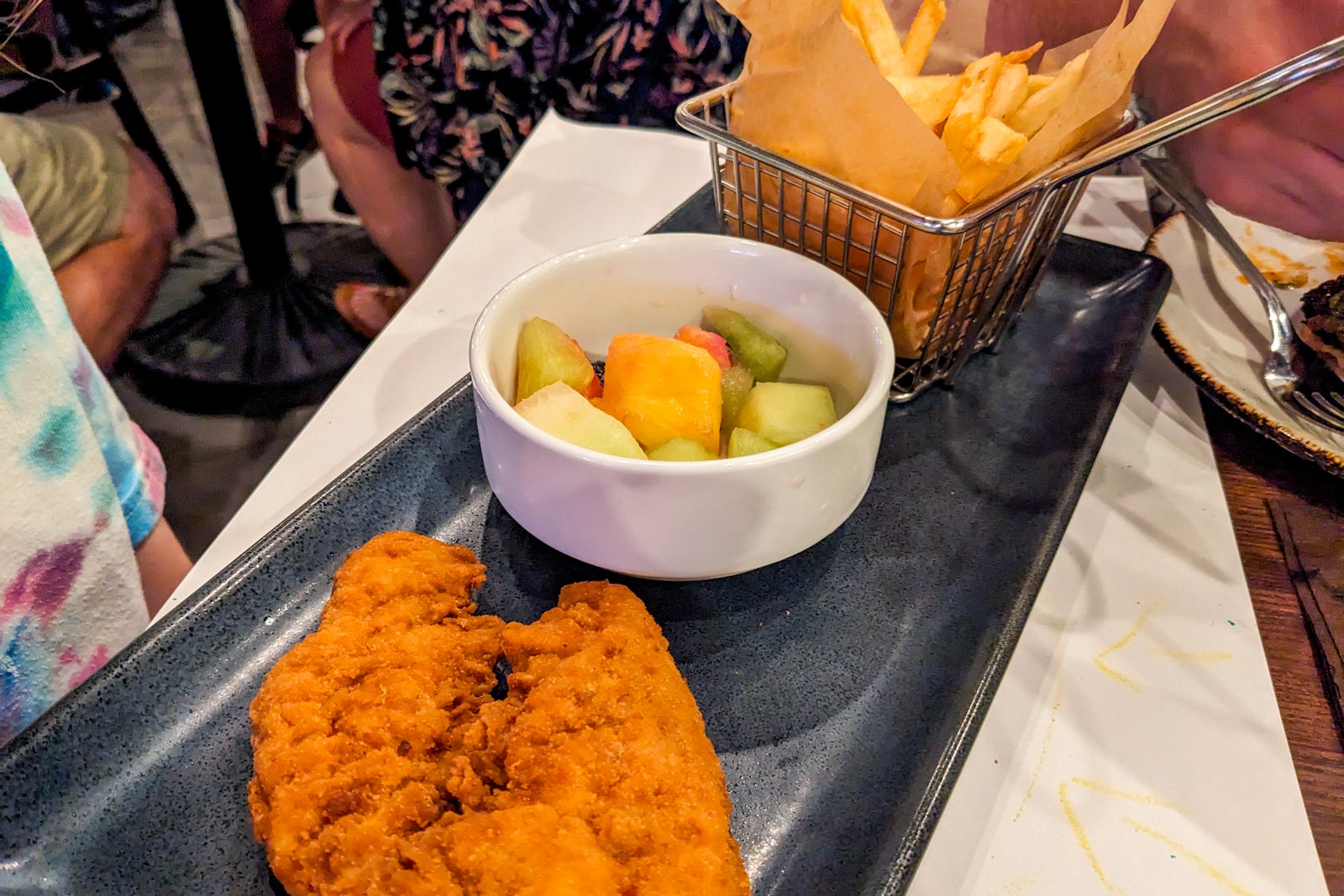 Plate with chicken tenders, fruit and French fries at Great Wolf Lodge Maryland