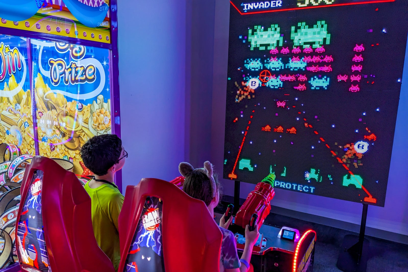 Kids playing Space Invaders at Great Wolf Lodge Maryland arcade