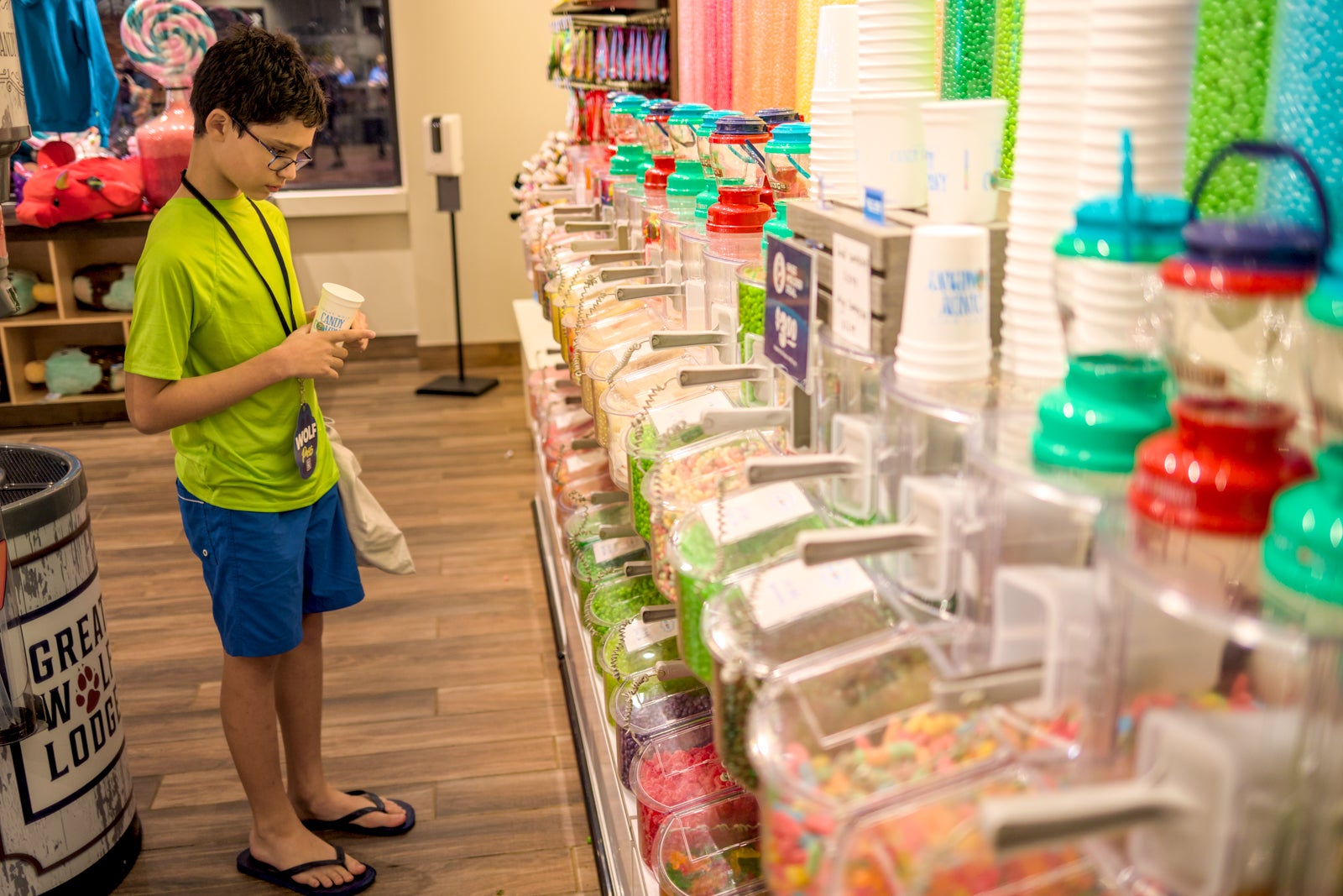 Boy choosing from bulk candy bins