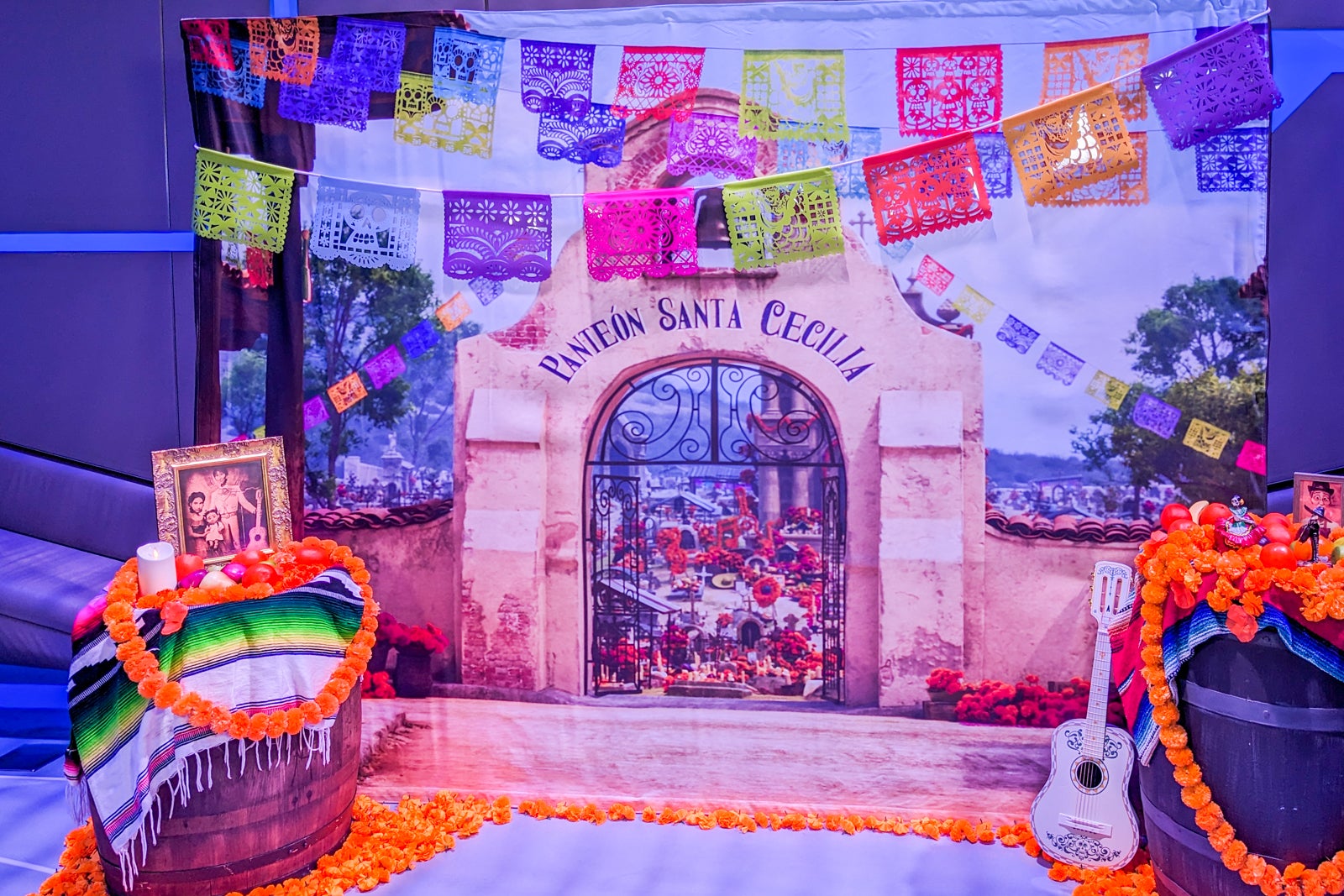 A photo backdrop of the town of Santa Cecilia from the movie "Coco."