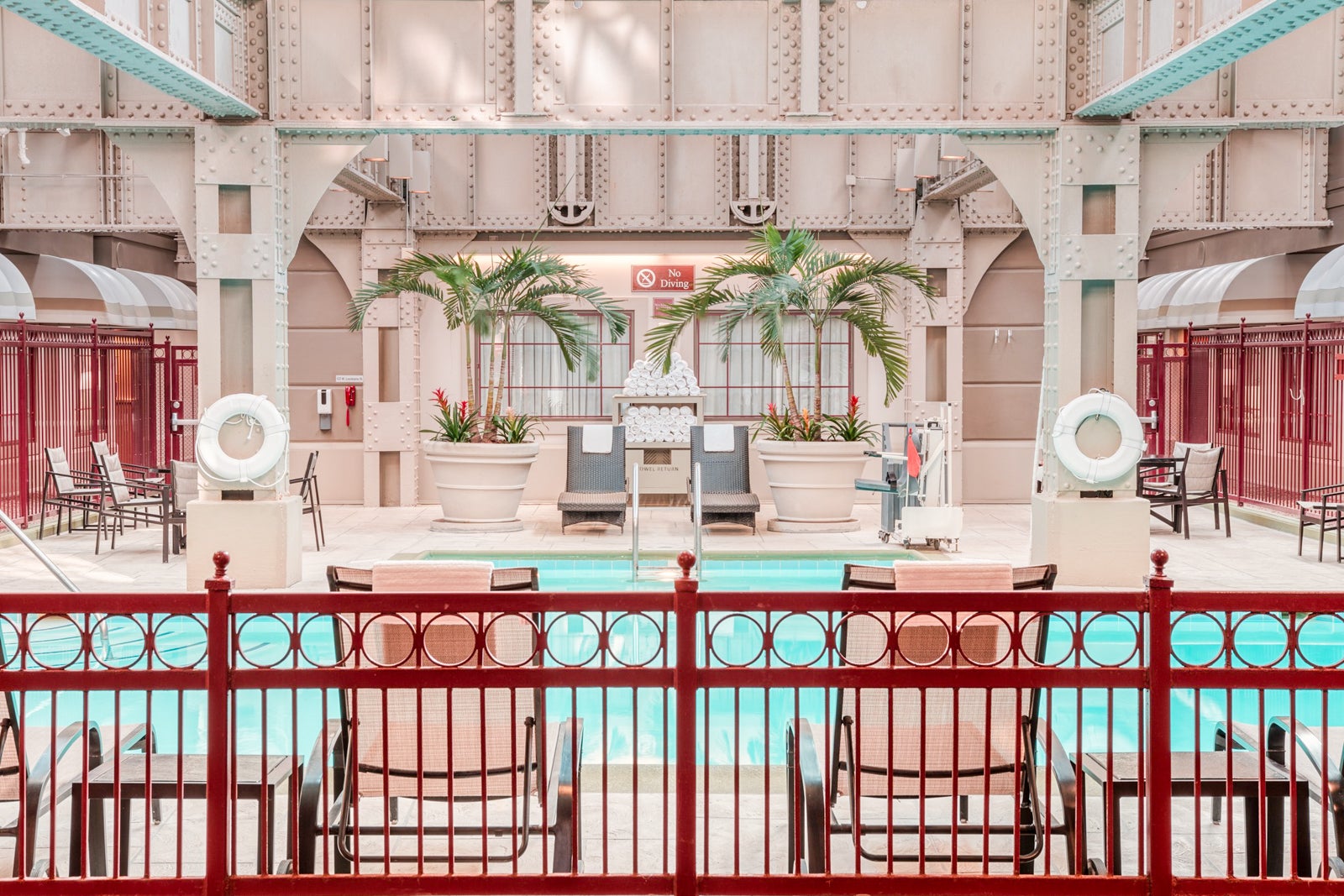 indoor pool with lounge chairs at Crowne Plaza Indianapolis Downtown